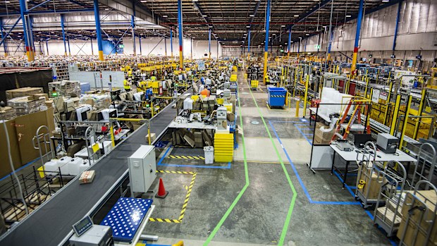 Amazon Associates working inside the Amazon Fulfilment Centre in Moore Park, Sydney.