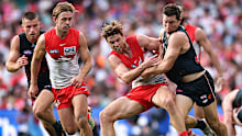 Dane Rampe of the Swans and Toby Greene of the Giants contest the ball.