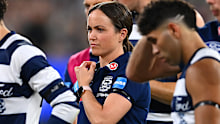 MELBOURNE, AUSTRALIA - MARCH 17: Daisy Pearce looks on as Cats head coach Chris Scott  speaks to his players  during the round one AFL match between Geelong Cats and Collingwood Magpies at Melbourne Cricket Ground, on March 17, 2023, in Melbourne, Australia. (Photo by Quinn Rooney/Getty Images)