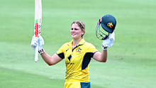 Georgia Voll of Australia celebrates after scoring a century.