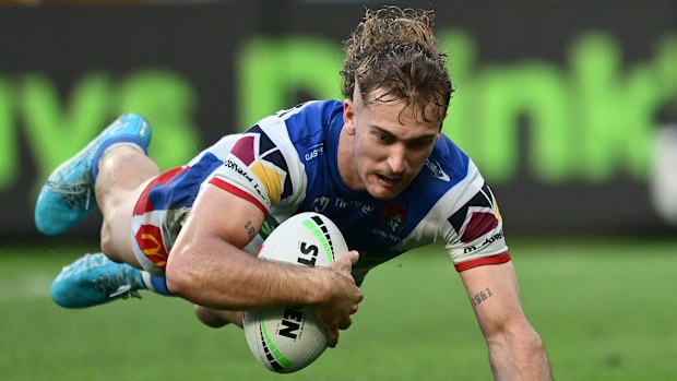 Fletcher Sharpe of the Knights scores his third try against the Rabbitohs.