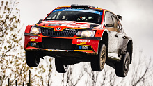 Shane van Gisbergen flies his Skoda Fabia R5 over a jump on the final stage of Rally New Zealand.