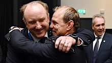 Brett Robinson is congratulated by Phil Waugh.