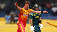 Brad Evans celebrates the wicket of Travis Head.