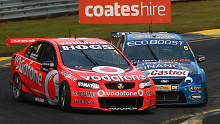 Mark Winterbottom (No.5 Ford FG Falcon) and Jamie Whincup (No.1 Holden VE Commodore) come to blows on lap 159 of the 2011 Sandown 500 
