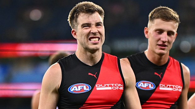 Zach Merrett of the Bombers looks dejected after losing to the Hawks.