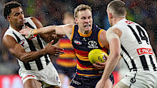 ADELAIDE , AUSTRALIA - AUGUST 16: Jordan Dawson of the Crows and Isaac Quaynor of the Magpies and Darcy Cameron of the Magpies during the 2025 AFL Round 23 match between the Adelaide Crows and the Collingwood Magpies at Adelaide Oval on August 16, 2025 in Adelaide, Australia. (Photo by Sarah Reed/AFL Photos via Getty Images)