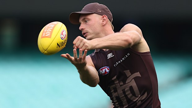 James Worpel of the Hawks handpasses during a Hawthorn Hawks AFL training