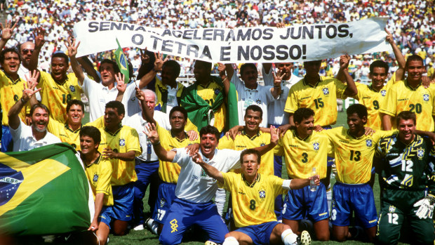 The victorious Brazilian team celebrate winning the final with a banner in memory of the Brazilian Formula One star, Ayrton Senna who was killed in San Marino in May.  (Photo by Peter Robinson/EMPICS via Getty Images)