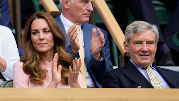 Kate, Duchess of Cambridge sits in the Royal Box with her father Michael Middleton to watch the men's singles final between Serbia's Novak Djokovic and Italy's Matteo Berrettini on day thirteen of the Wimbledon Tennis Championships in London, Sunday, July 11, 2021. (AP Photo/Kirsty Wigglesworth)