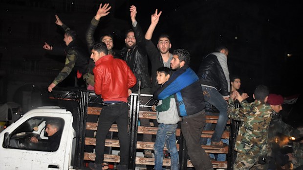 People took to the streets of Aleppo to celebrate the Syrian's army advance. (AFP)