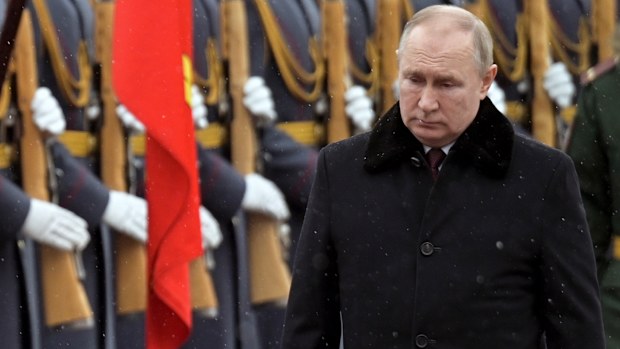 Russian President Vladimir Putin attends a wreath-laying ceremony at the Tomb of the Unknown Soldier, near the Kremlin Wall during the national celebrations of the 'Defender of the Fatherland Day' in Moscow, Russia.
