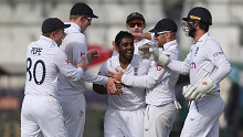 KARACHI, PAKISTAN - DECEMBER 19: Rehan Ahmed of England is congratulated on the wicket of Mohammad Rizwan of Pakistan during day three of the Third Test between Pakistan and England at Karachi National Stadium on December 19, 2022 in Karachi, Pakistan. (Photo by Matthew Lewis/Getty Images)