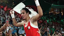 PARIS, FRANCE - AUGUST 09: Imane Khelif of Team Algeria celebrates to the crowd after winning the gold medal following the Boxing Women's 66kg Final match against Liu Yang of Team China on day fourteen of the Olympic Games Paris 2024 at Roland Garros on August 09, 2024 in Paris, France. (Photo by Richard Pelham/Getty Images)