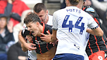 Blackburn Rovers' Owen Beck is bitten on the neck by Preston North End's Milutin Osmajic.