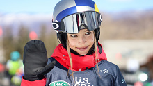 China's Eileen Gu waves to the camera after competing in the women's halfpipe skiing qualifiers of the U.S. Grand Prix and World Cup last March.