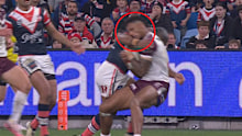Michael Jennings collects Jason Saab high during the Roosters win. 