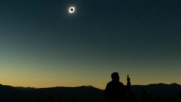 Sun completely eclipsed in Chilean desert.