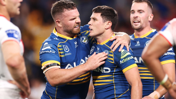 Nathan Brown of the Eels congratulates Mitchell Moses as he celebrates a try.