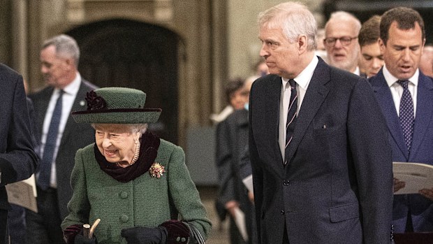 Britain's Queen Elizabeth II and Prince Andrew, center right, arrive for a Service of Thanksgiving for the life of Prince Philip, Duke of Edinburgh, at Westminster Abbey in London, Tuesday, March 29, 2022. (Richard Pohle/Pool via AP)