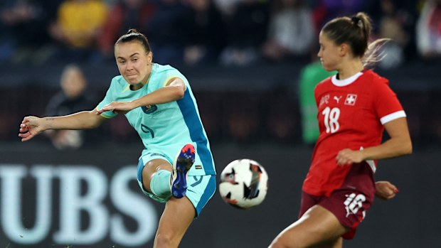 Caitlin Foord of Australia shoots the ball under pressure from Viola Calligaris of Switzerland during the Women's international friendly match between Switzerland and Australia at Stadion Letzigrund on October 25, 2024 in Zurich, Switzerland. (Photo by Arnd Wiegmann/Getty Images for Football Australia)
