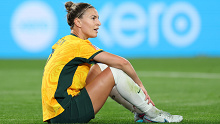 Steph Catley goes down injured during Australia's pool match against Denmark at the 2024 FIFA Women's World Cup.