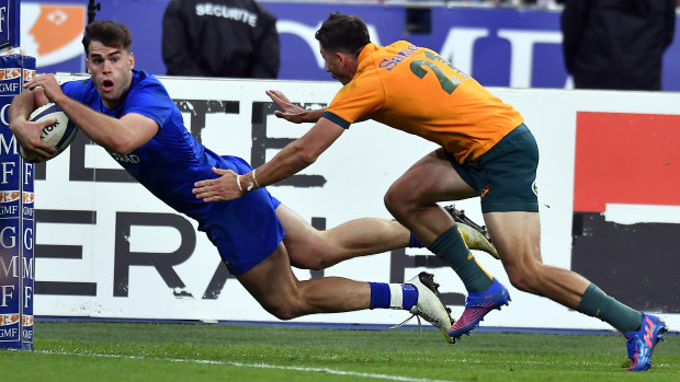 Damian Penaud of France scores a try.