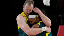 Australia's Joe Ingles (7) and Patty Mills (5) react after beating Slovenia 107-93 during the men's bronze medal basketball game at the 2020 Summer Olympics, Saturday, Aug. 7, 2021, in Tokyo, Japan.