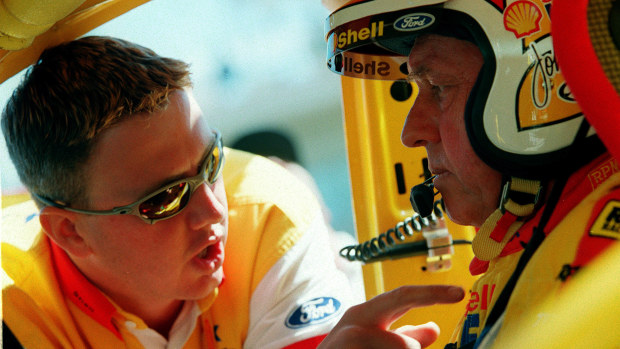 Steven Johnson and Dick Johnson from the Shell Helix racing team talk tactics in the Ford during the practice rounds of the Bathurst FAI 1000 at Mount Panorama,Bathurst Australia. Mandatory Credit: Adam Pretty/ALLSPORT