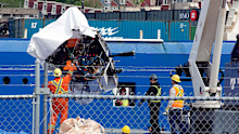 Debris from the Titan submersible, recovered from the ocean floor near the wreck of the Titanic, is unloaded from the ship Horizon Arctic at the Canadian Coast Guard pier in St. John's, Newfoundland, June 28, 2023.