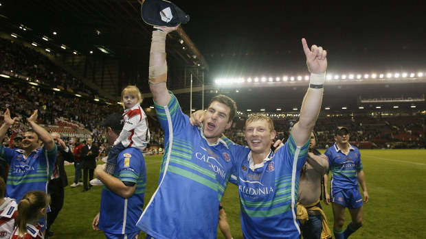 Peter Shiels and Sean Long of St Helens celebrate victory after the Super League Grand Final between Bradford Bulls and St.Helens held on October 19, 2002 at Old Trafford, in Manchester, England. St.Helens won the match 19- 18. DIGITAL IMAGE. (Photo by Alex Livesey/Getty Images)
