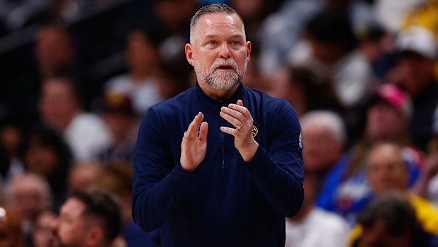Coach Michael Malone claps on the sidelines during the third quarter against the Indiana Pacers