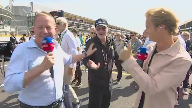Martin Brundle and F1 world champion Nico Rosberg speak to former Ferrari driver Eddie Irvine. 