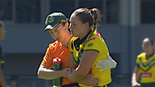 Keeley Davis leaves the field clutching at her elbow.