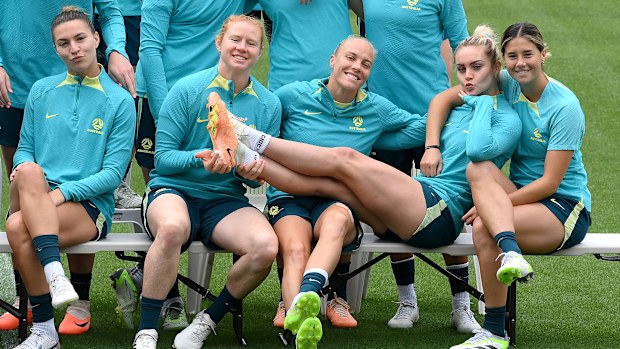 (L-R) Steph Catley, Clare Polkinghorne, Tameka Yallop, Ellie Carpenter and Kyra Cooney-Cross enjoy a candid moment as they pose for a team photo as the Matildas prepare for the bronze medal match against Sweden in Brisbane.