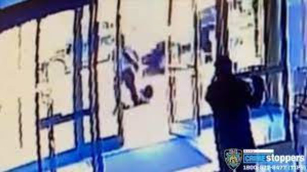 Two doormen from a New York city apartment building have been fired after surveillance video appears to show one of them closing the door as an Asian woman was attacked right outside.