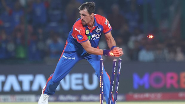 Mitchell Starc of Delhi Capitals runs out to Yashasvi Jaiswal of Rajasthan Royals.