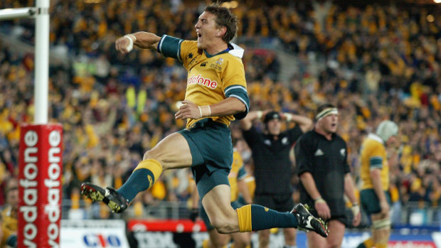 Mat Rogers of the Wallabies celebrates scoring a try in 2002.