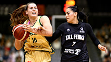 Isobel Borlase of the Opals attacks against Waiata Jennings of the Tall Ferns.