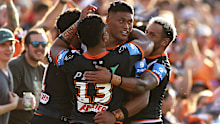 Stefano Utoikamanu celebrates with his Tigers teammates. 