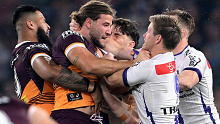 Pat Carrigan and Harry Grant lock horns in the Broncos' 2023 qualifying final clash with the Storm as Payne Haas (left) and Cameron Munster (right) get involved.
