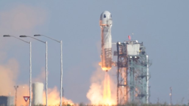 Blue Origin's New Shepard rocket launches carrying passengers William Shatner, Chris Boshuizen, Audrey Powers and Glen de Vries from its spaceport near Van Horn, Texas.