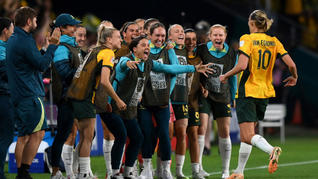 Emily Van-Egmond celebrates with Sam Kerr and the Matildas bench after scoring her team's goal against Nigeria during the FIFA Women's World Cup. 