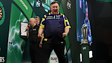 Luke Littler celebrates his victory.