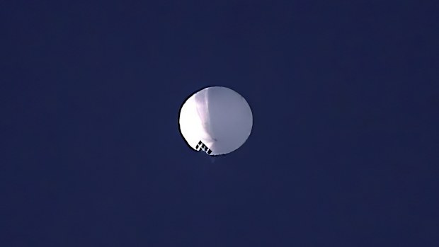 A high altitude balloon floats over Billings, Mont., on Wednesday, Feb. 1, 2023. The huge, high-altitude Chinese balloon sailed across the U.S. on Friday, drawing severe Pentagon accusations of spying and sending  excited or alarmed Americans outside with binoculars. Secretary of State Antony Blinken abruptly canceled a high-stakes Beijing trip aimed at easing U..S.-China tensions.(Larry Mayer/The Billings Gazette via AP)