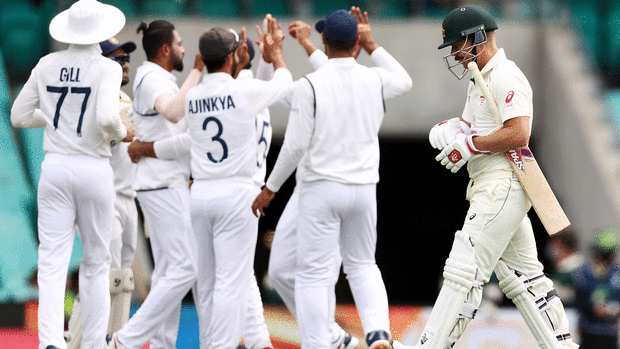 David Warner walks off after his dismissal.