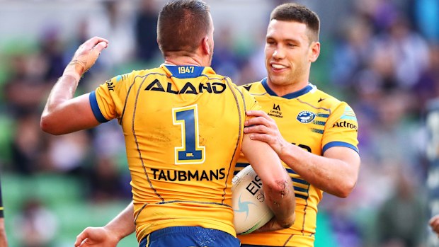 Eels player Tom Opacic (right) celebrates with Clint Gutherson.
