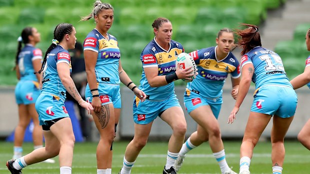 Titans players warm up before the round four NRLW match against the Eels. 