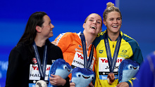 (L-R) Silver Medalist, Siobhan Bernadette Haughey of Team Hong Kong (obscured), Gold Medalist, Marrit Steenbergen of Team Netherlands and Bronze Medalist, Shayna Jack of Team Australia react as they leave the Medal Ceremony with their medals for the Women's 100m Freestyle Final on day fifteen of the Doha 2024 World Aquatics Championships at Aspire Dome on February 16, 2024 in Doha, Qatar. (Photo by Maddie Meyer/Getty Images)