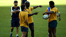 Mat Rogers, Wendell Sailor and Lote Tuqiri talk tactics under the watch of Eddie Jones in 2003.